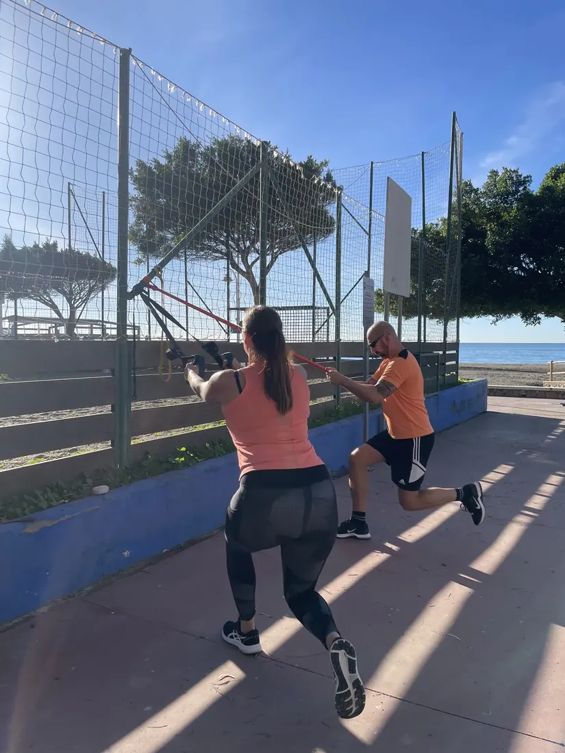 English-speaking personal trainer running an at-home session in Málaga